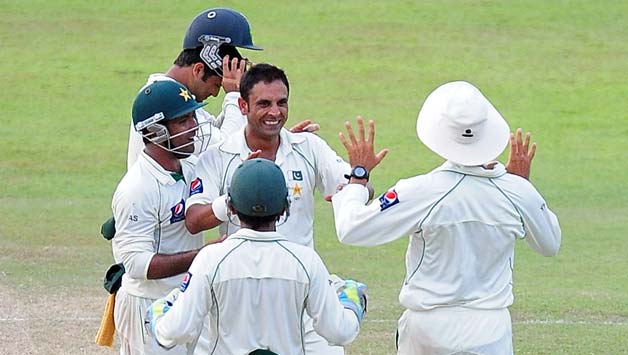 Abdur Rehman (centre)'s six wicket haul in the second innings set up Pakistan's improbable victory © AFP