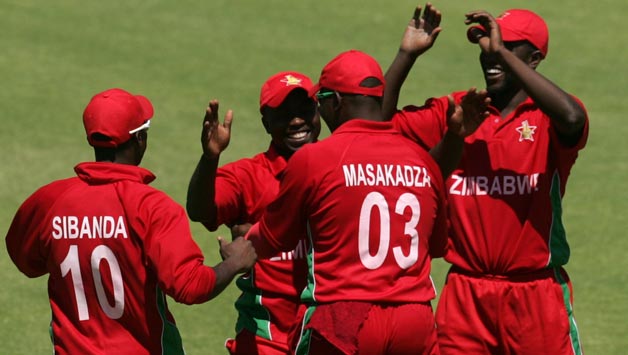 Zimbabwe-players-celebrate-a-wicket-during-the-first-game-of-the-three-match-ODI-cricket-series-between-Pakistan-and-hosts-Zimbabwe-at-the-Harare-Sports-Club