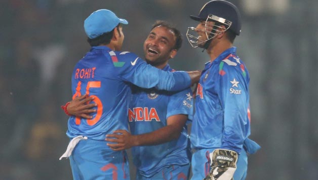 Amit Mishra (Centre) is congratulated by his teammates after the fall of a wicket © Getty Images