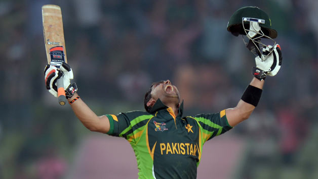 Pakistani-batsman-Umar-Akmal-celebrates-after-scoring-a-century-(100-runs)