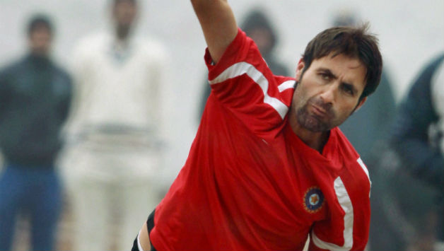 Parvez Rasool bowls during nets-horz