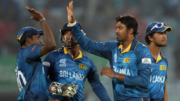 Sachithra Senanayake (second from right) took two wickets for Sri Lanka © AFP