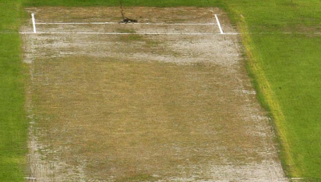 A-general-view-of-the-Lancashire-wicket,-as-play-is-delayed-due-to-the-bad-conditio