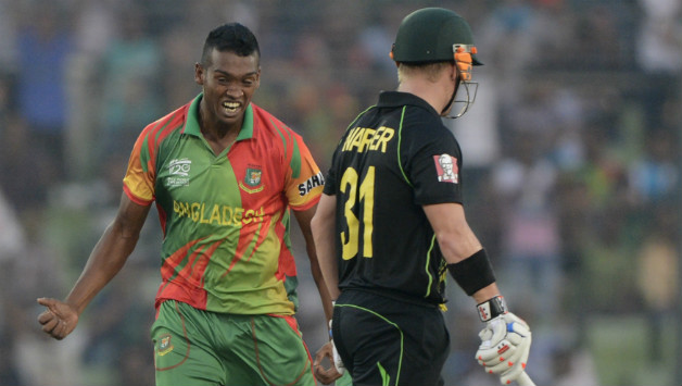Al-Amin Hossai (left) almost chased David Warner off the field giving him a few choice verbals as he celebrated in his face © AFP