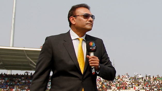 Commentator-Ravi-Shastri-and-Captain-MS-Dhoni-of-India-look-on-as-Captain-Shak
