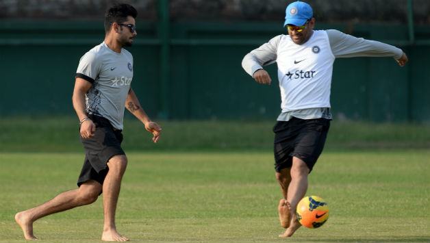 Virat Kohli (left) said MS Dhoni plays the best football amongst Indian cricketers © AFP