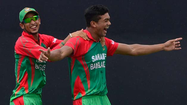 Bangladeshi-cricketer-Taskin-Ahmed-(R)-celebrates-with-his-teammate-after-th