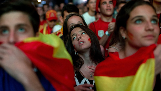 Spanish fans feel dejected after the loss to Chile © Getty Images