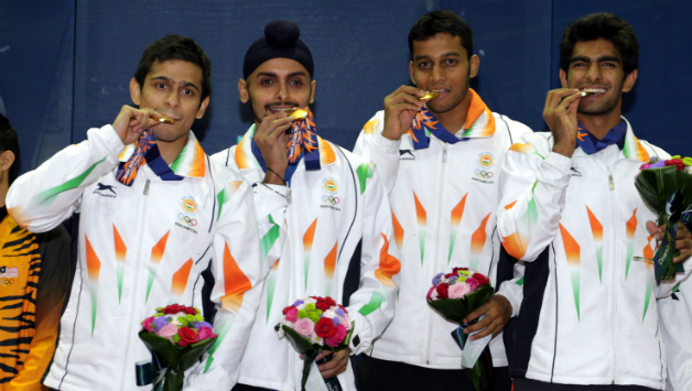 India Team kisses their Gold Medals at the presentation ceremony after they beaten Malaysia during Squash Mens Team Final during day eight of the 2014 Asian Games at Yeorumul Squash Courts on September 27, 2014 in Incheon, South Korea © Getty Images