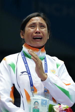 Sarita Devi in tears at the podium during the medal presentation ceremony at the Incheon Asian Games 2014 © Getty Images