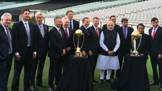 Narendra Modi along with his Australian counterpart Tony Abbott and cricketing greats like Sunil Gavaskar, Allan Border poses with ICC Cricket World cup trophy at the MCG. Photo Courtesy: Official Twitter account of Dean Jones