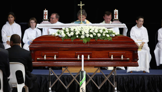 Phillip Hughes's cricket bat rests against his coffin during the Funeral Service for Phillip Hughes at Macksville High School Stadium on December 3, 2014 in Macksville, Australia.