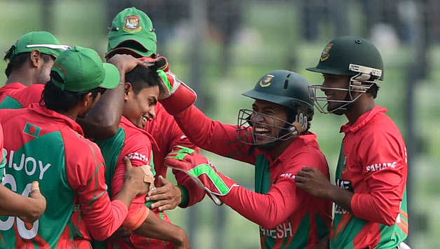 Bangladesh celebrate Taijul Islam's hat-trick on Monday © AFP
