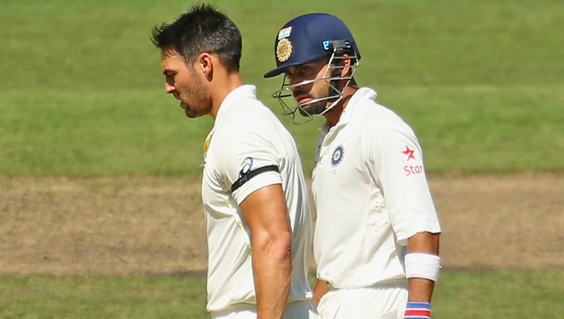 Tensions threatened to explode on Sunday in the ongoing Boxing Day Test when Mitchell Johnson (left) hit Virat Kohli while trying to run him out © Getty Images