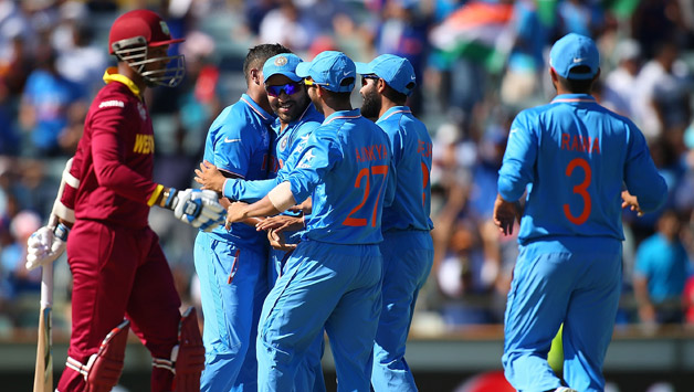 The Indian players celebrate the wicket of West Indies wicket-keeper batsman Denesh Ramdin (left) © Getty Images