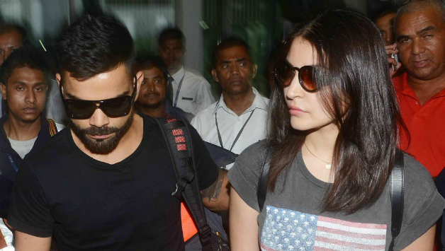 Virat Kohli (left) and Anushka Sharma arrive at the Kolkata Airport ahead of the IPL 2015 opening ceremony. Photo Courtesy: @Fashion101.in (via Twitter)