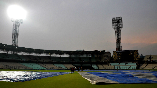 The Eden Gardens staff brought the covers on the pitch on Monday, with the skies continuing to be overcast © IANS