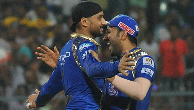 Harbhajan Singh (left) celebrates a dismissal with Mumbai Indians skipper Rohit Sharma © IANS