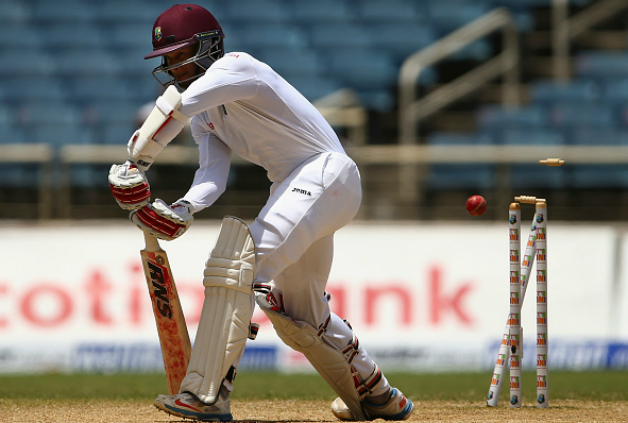 Relentless attack from fast bowlers produced a procession of wickets: Shai Hope is bowled by Mitchell Johnson © Getty Images
