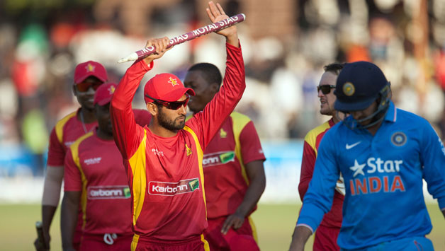 Zimbabwe-stand-in-captain-Raza-Butt-(L)-salutes-the-crowd-after-securing-a-victory