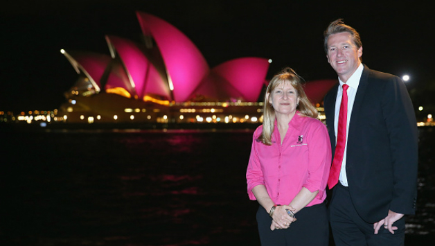 Glenn McGrath and nurse Elaine Arnold, with Sydney Opera House in background turned pink to raise Breast Cancer awareness © Getty Images