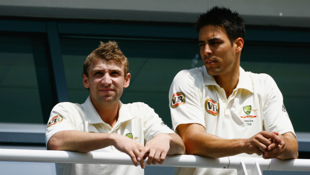 Phil Hughes (left) and Mitchell Johnson look on during the 1st Test of the 2009 Ashes at Cardiff © Getty Images
