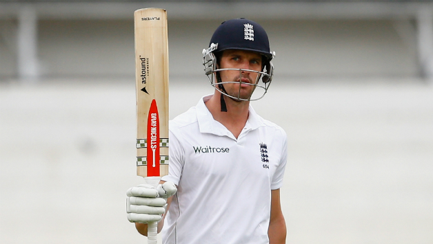 Nick Compton raises his bat after completing his half-century © Getty Images