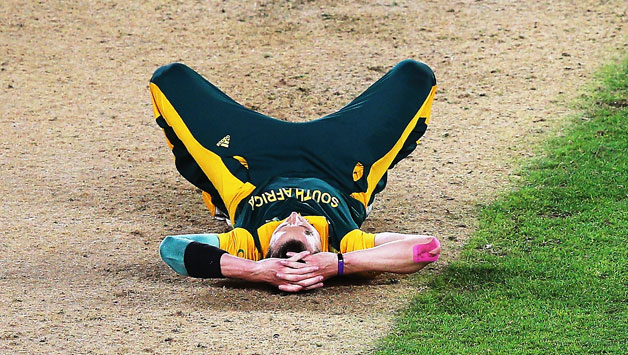 A dejected Dale Steyn (above) lies on the pitch after Grant Elliott hits the winning six for New Zealand to defeat South Africa by four wickets © Getty Images