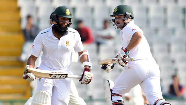 Hashim Amla and Dean Elgar run between the wickets on Day 2 of the 1st Test at Mohali © AFP