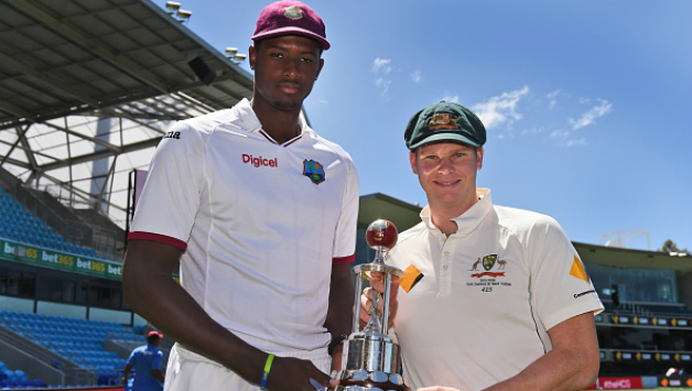 Jason Holder(L) with Steven Smith(R) with the Frank Worrell Trophy 2015-16 © Getty Images