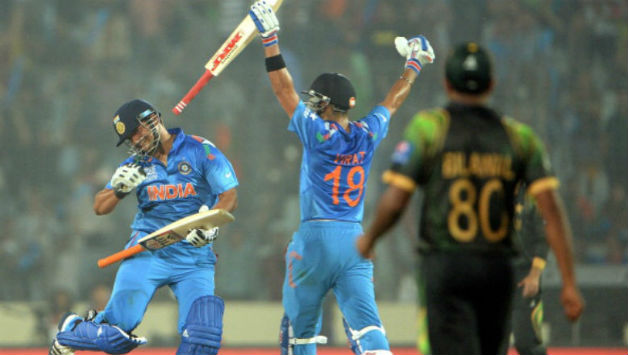 Suresh Raina (left) and Virat Kohli celebrate after winning the ICC World T20 match against Pakistan at Dhaka (Photo courtesy: Getty Images)