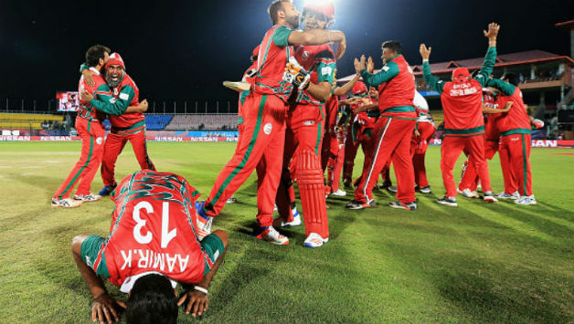 Oman celebrate their victory over Ireland during the ICC World T20 match against Ireland at Dharamsala, India. Image courtesy: Getty Images
