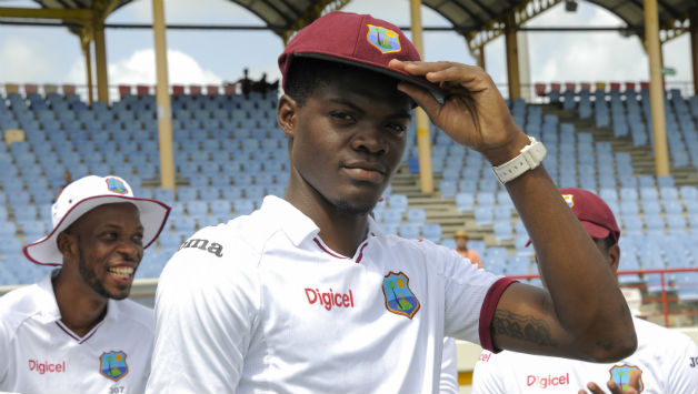 Alzarri Joseph poses with the Test cap before the start of play on Day One © AFP