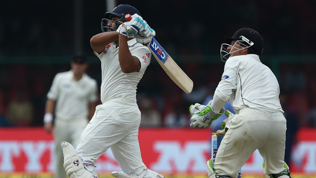 Rohit Sharma smashes a six on the first day of the opening Test versus New Zealand © AFP