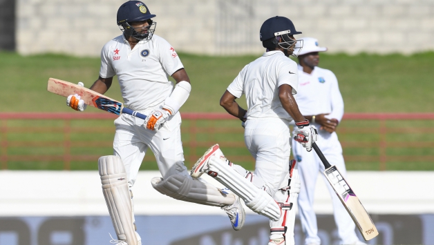Ravichandran Ashwin (Left) and Wriddhiman Saha built a few crucial partnerships for India in the Caribbean © AFP