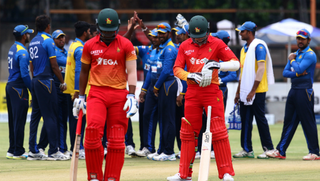 Zimbabwe batsman Chamunorwa Chibhabha walks back after being dismissed © AFP