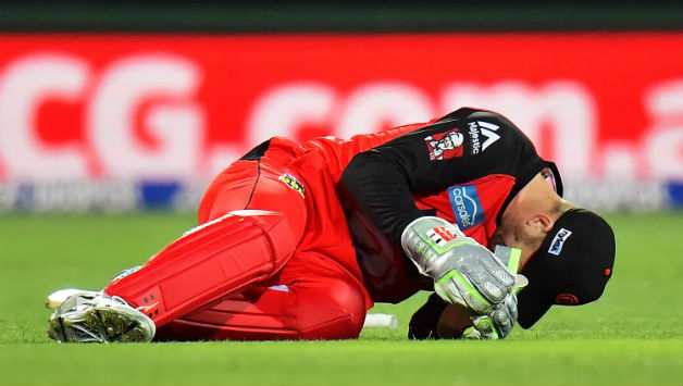 Peter Nevill falls to the ground after being struck in the head by the bat of Brad Hodge © Getty Images
