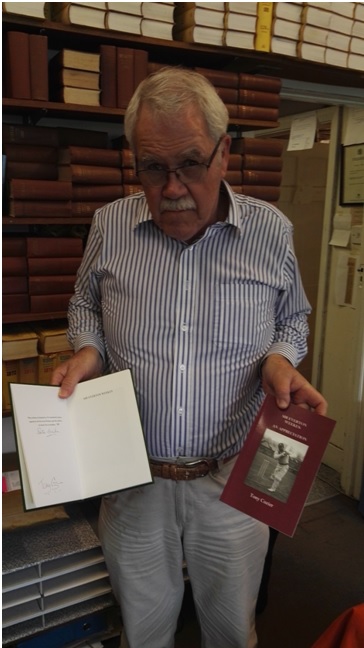 John McKenzie: Publisher of the volume, holding the limited edition signed by Everton Weekes and Tony Cozier and the regular edition with stiffened wrappers. Photo courtesy: Arunabha Sengupta