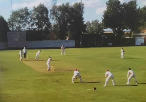 Cricket in progress at the Lintz Cricket Ground, Burnopfield, Durham. Note the high concrete fence. Pic courtesy: Lintz Cricket Club, subsequently used on the cover of the book Court & Bowled — Tales of Cricket and the Law
