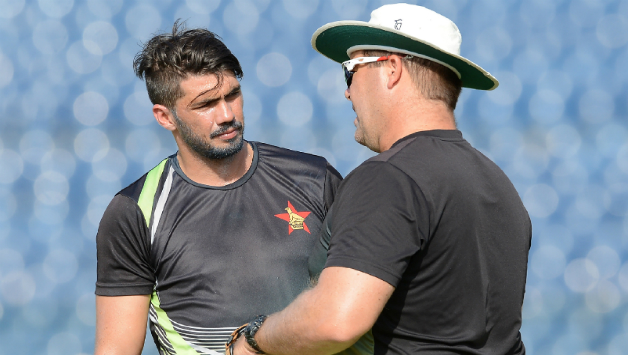 Graeme Cremer with Heath Streak © AFP