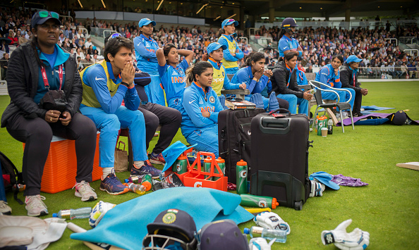 Dejected India Women watch their side collapse against England in the final © Getty Images