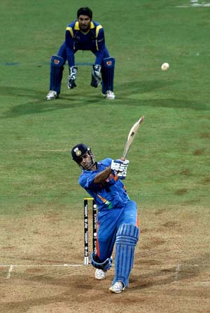 Sealing it with a six: MS Dhoni launches Nuwan Kulasekara into the orbit to mastermind India’s triumph in the World Cup final © Getty Images