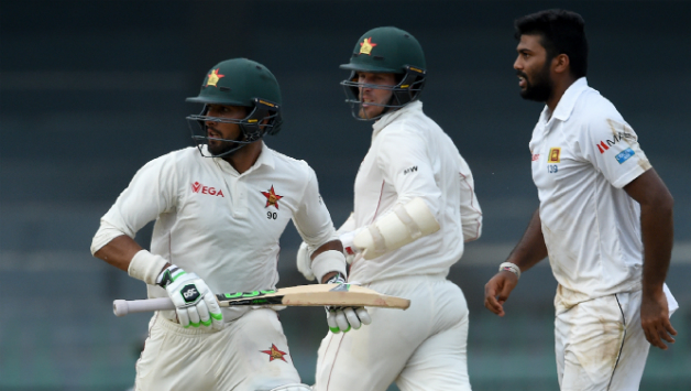 Raza and Moor formed an unbeaten 107-run partnership © AFP