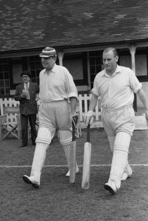 Bernard Hollowood (left) walks out to bat with EW Swanton © Getty Images