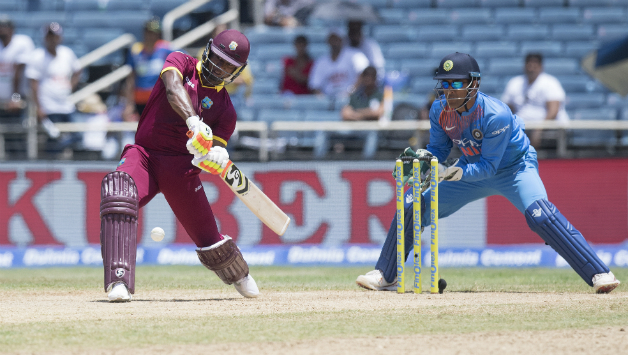 Evin Lewis and MS Dhoni © AFP