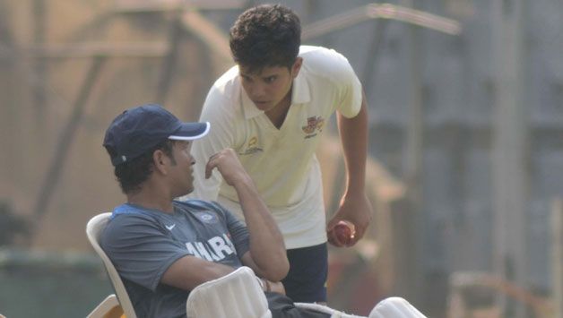 Sachin Tendulkar with Arjun Tendulkar © IANS