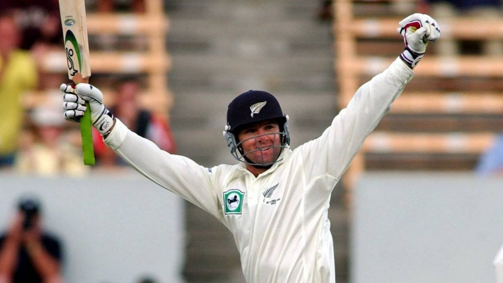 Astle celebrating after smashing a double-ton
